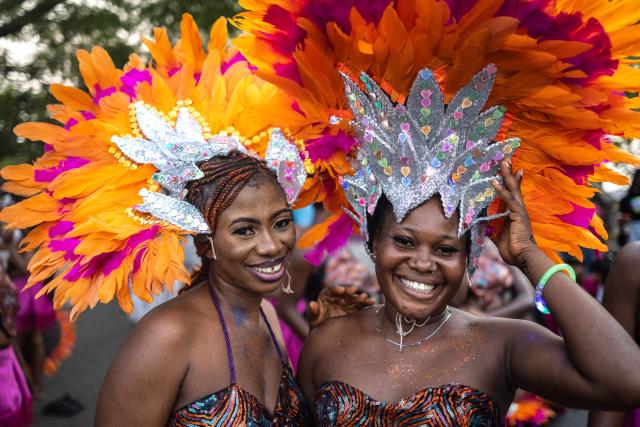 Participants pose for a photograph as they parade during Calabar Carnival in Calabar on December 28, 2024. Calabar Carnival is an annual carnival held in Cross River State, Nigeria: it is celebrated every December to mark Christmas celebration yearly. The quality of the festival has grown over the years making it Nigeria's biggest carnival and an internationally recognized festival. (Photo by OLYMPIA DE MAISMONT / AFP)