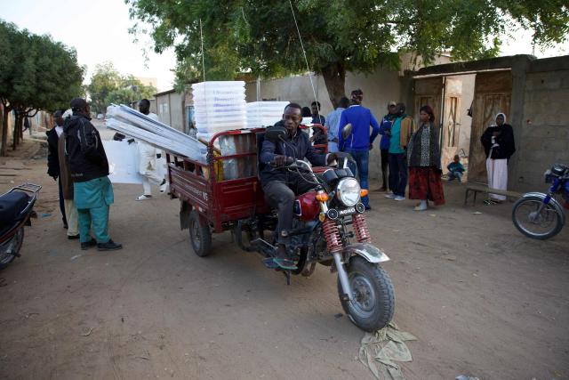 Electoral material is driven towards a polling station in N'Djamena on December 29, 2024 at the beginnning of the local, provincial and legislative elections. Chad goes to the polls Sunday for legislative, provincial and local elections that are presented by the government as the last stage of a political transition after three years of military rule, but are being boycotted by the opposition. The boycott leaves the field open to candidates aligned with Marshal Mahamat Idriss Itno, who was brought to power by the military in 2021 and then legitimised in a presidential election last May that opposition candidates denounced as fraudulent. (Photo by Joris Bolomey / AFP)