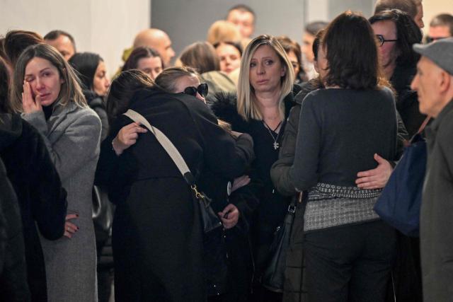 Friends and families of the students killed in last year's mass shooting at an elementary school in Serbia's capital, leave the courtroom in Belgrade on December 30, 2024, ahead of the verdict sentencing the parents of a 13-year-old boy to prison for fatally shooting nine students and a security guard. The trial was conducted solely against the teenager's parents, Vladimir and Miljana Kecmanovic, as their son cannot be criminally prosecuted due to his age, Vladimir Kecmanovic beibg sentenced to 14 years and six months while Miljana Kecmanovic was jailed for three years, the Belgrade Higher Court said in a statement. (Photo by Andrej ISAKOVIC / AFP)