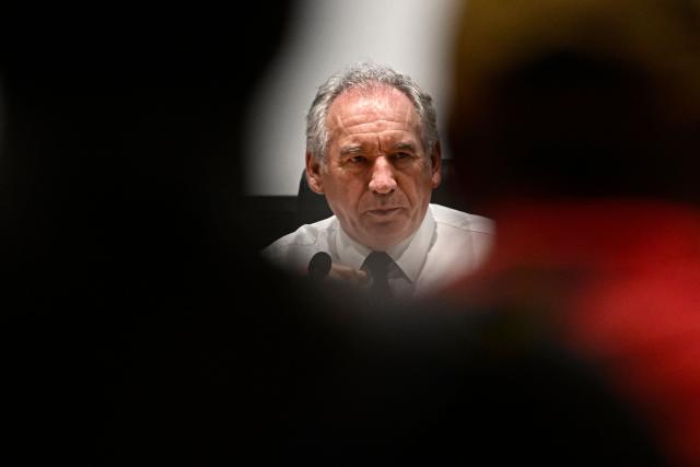 French Prime Minister Francois Bayrou attends a meeting with local officials to present his plan at the departmental council in Mamoudzou on the French Indian Ocean territory of Mayotte, on December 30, 2024. The most devastating cyclone to hit Mayotte in 90 years caused colossal damage on December 14, 20274 in France's poorest department, where relief workers have struggled since then to restore essential services such as water, electricity and communications networks. (Photo by JULIEN DE ROSA / AFP)