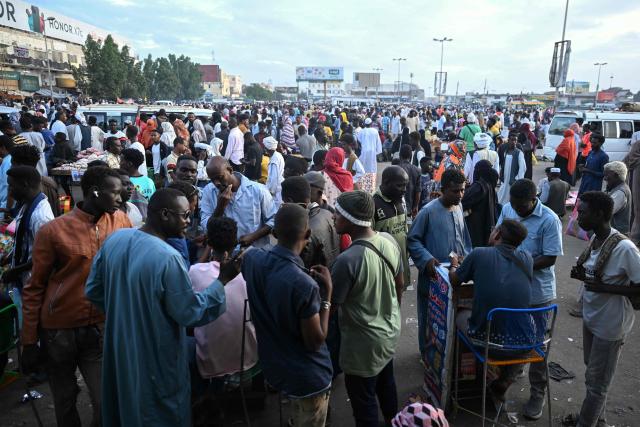 People struggling to commute gather in Port Sudan as local transportation is strangled after government authorities reportedly changed two currency notes, invalidating old notes, on December 30, 2024, in the army-controlled Red Sea city city, where the government loyal to the army is based. Sudan is reeling from 20 months of fighting between the Sudanese army and the paramilitary Rapid Support Forces, led by rival generals, which have led to a dire humanitarian crisis. The war since April 2023 has killed tens of thousands of people and uprooted 12 million, creating what the United Nations has called the world's largest displacement crisis. (Photo by AFP)