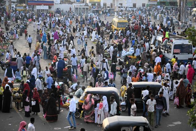 People struggling to commute gather in Port Sudan as local transportation is strangled after government authorities reportedly changed two currency notes, invalidating old notes, on December 30, 2024, in the army-controlled Red Sea city city, where the government loyal to the army is based. Sudan is reeling from 20 months of fighting between the Sudanese army and the paramilitary Rapid Support Forces, led by rival generals, which have led to a dire humanitarian crisis. The war since April 2023 has killed tens of thousands of people and uprooted 12 million, creating what the United Nations has called the world's largest displacement crisis. (Photo by AFP)