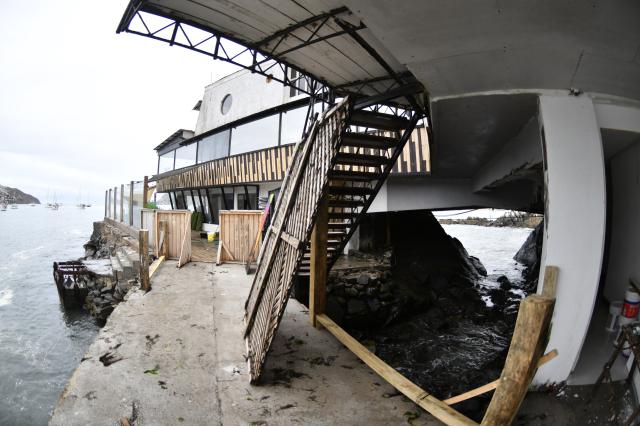 Picture of a restaurant damaged by strong waves that hit the seafront in La Serena, Chile, taken on December 30, 2024. Three deaths, one in Chile, have been blamed on large waves up to 13 feet (four metres) pummelling Ecuador, Chile and Peru, where nearly 100 ports have been closed because of the rough conditions. The phenomenon began on Christmas and is expected to last until January 1, according to Peru's National Emergency Operations Center. (Photo by Alejandro PIZARRO / AFP)