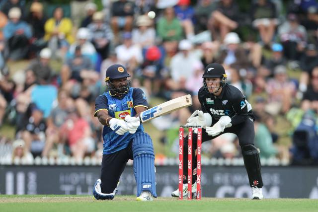 Sri Lanka's Kusal Perera (L) plays a shot as New Zealand wicketkeeper Mitch Hay looks on during the third Twenty20 cricket match between New Zealand and Sri Lanka at Saxton Oval in Nelson on January 2, 2025. (Photo by Marty MELVILLE / AFP)