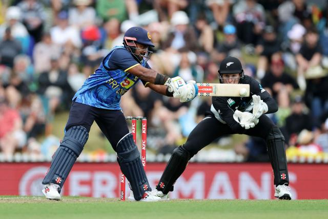 Sri Lanka's captain Charith Asalanka (L) plays a shot as New Zealand wicketkeeper Mitch Hay looks on during the third Twenty20 cricket match between New Zealand and Sri Lanka at Saxton Oval in Nelson on January 2, 2025. (Photo by Marty MELVILLE / AFP)