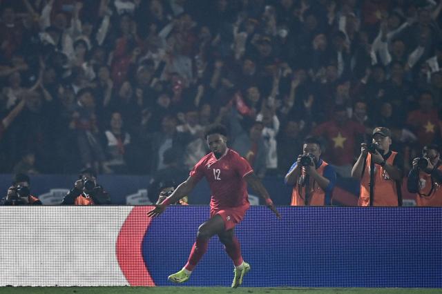 Vietnam's forward Rafaelson celebrates after scoring a goal during the 2024 ASEAN Electric Cup final first leg football match between Vietnam and Thailand at the Viet Tri Stadium in Phu Tho province on January 2, 2025. (Photo by NHAC NGUYEN / AFP)