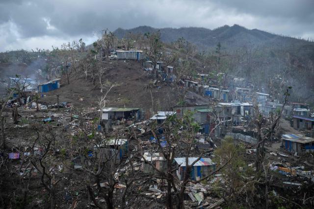 This photograph shows a view of destroyed houses in shanty town of a Cavani south district damaged by the cyclone Chido in the city of Mamoudzou, on the French Indian Ocean territory of Mayotte, on January 2, 2025. The most devastating cyclone to hit Mayotte in 90 years caused colossal damage on December 14, 2024 in France's poorest department. (Photo by JULIEN DE ROSA / AFP)