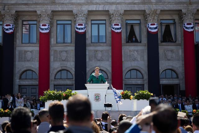 Puerto Rico's newly sworn-in Governor Jennifer Gonzalez delivers her inaugural speech during an outdoor ceremony at the Capitol building in San Juan, Puerto Rico on January 2, 2025. (Photo by Ricardo ARDUENGO / AFP)