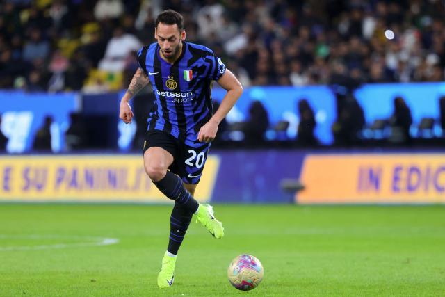 Inter Milan's Turkish midfielder #20 Hakan Calhanoglu passes the ball during the Italian Super Cup semi-final football match between Inter Milan and Atalanta at the Al-Awwal Park in Riyadh on January 2, 2025. (Photo by Fayez NURELDINE / AFP)