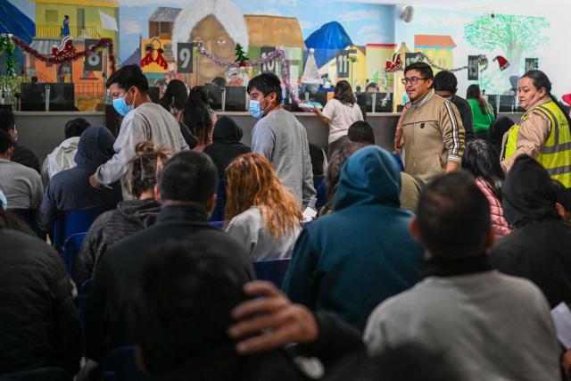 Guatemalan migrants deported from the United States wait to be assisted at the Returnee Reception Center upon arrival at the Guatemalan Air Force Base in Guatemala City on January 2, 2025, during the first deportee flight of the year. Guatemala closes 2024 with more than 61,000 deported from the US. (Photo by JOHAN ORDONEZ / AFP)