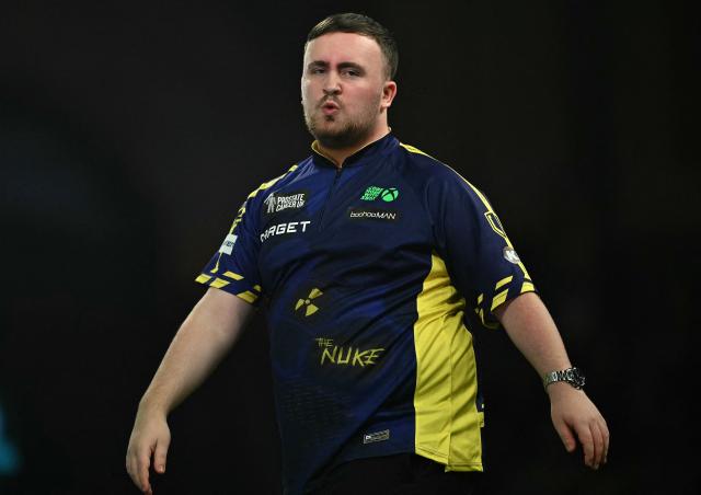 England's Luke Littler reacts as he plays against England's Stephen Bunting during their PDC World Darts Championship semi-final at Alexandra Palace in London on January 2, 2025. (Photo by Ben STANSALL / AFP)