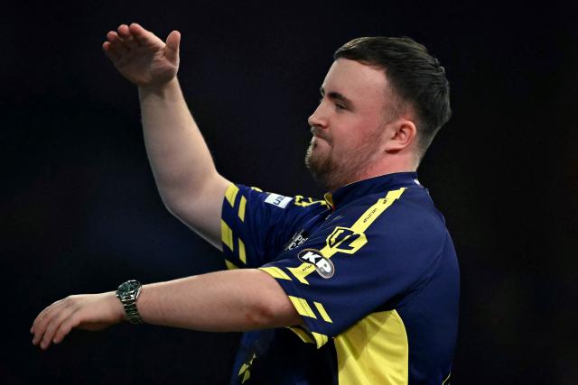 England's Luke Littler reacts as he plays against England's Stephen Bunting during their PDC World Darts Championship semi-final at Alexandra Palace in London on January 2, 2025. (Photo by Ben STANSALL / AFP)