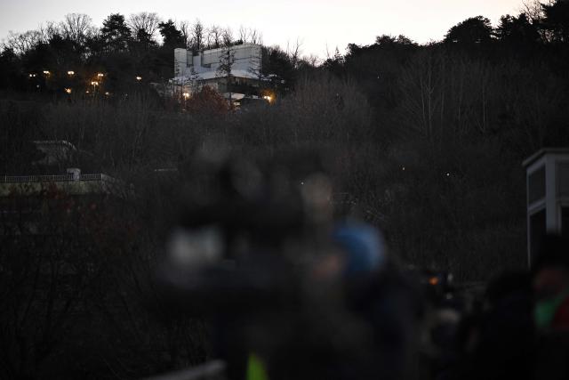 The residence of South Korea's impeached President Yoon Suk Yeol is seen in Seoul on January 3, 2025. South Korea's impeached President Yoon Suk Yeol remained defiantly in his residence in Seoul on Thursday as investigators probing his ill-fated declaration of martial law sought to detain him for questioning. Investigators have an arrest warrant but Yoon's die-hard supporters, including far-right YouTube personalities, are gathering outside in a bid to protect him, setting up potential clashes with police and anti-Yoon protesters. (Photo by Philip FONG / AFP)