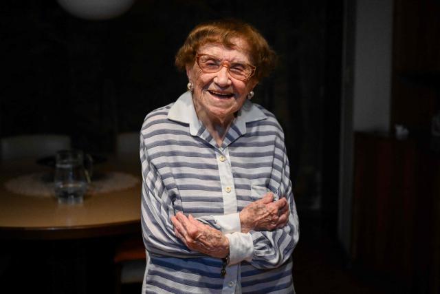 Holocaust survivor Lea Zajac de Novera, 98, poses for a picture during an interview with AFP in Buenos Aires on January 2, 2025. Zajac de Novera was born in Michalowo, a town in the province of Bialystok, Poland, on December 31, 1926. At the beginning of the war, she lived with her family under Soviet occupation until 1942, when she and her family were relocated to the Pruzhany ghetto. In 1943 she was deported to the Auschwitz-Birkenau concentration camp, where she worked collecting rubble and sorting clothes of those killed in the gas chambers. (Photo by LUIS ROBAYO / AFP)