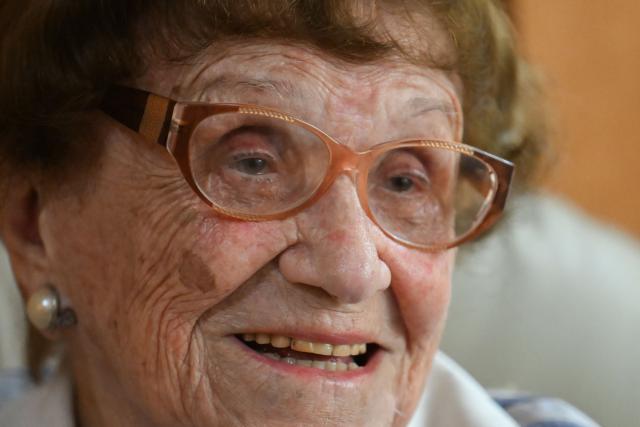 Holocaust survivor Lea Zajac de Novera, 98, speaks during an interview with AFP in Buenos Aires on January 2, 2025. Zajac de Novera was born in Michalowo, a town in the province of Bialystok, Poland, on December 31, 1926. At the beginning of the war, she lived with her family under Soviet occupation until 1942, when she and her family were relocated to the Pruzhany ghetto. In 1943 she was deported to the Auschwitz-Birkenau concentration camp, where she worked collecting rubble and sorting clothes of those killed in the gas chambers. (Photo by LUIS ROBAYO / AFP)