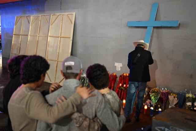 People react at a memorial set up on Bourbon Street on January 2, 2025 in New Orleans, Louisiana, the day after an attack by a man driving a truck down Bourbon street in the French Quarter. A US army veteran loyal to the Islamic State jihadist group likely acted alone when he killed 14 and injured dozens in a truck attack on a crowd of New Year revelers in New Orleans, the FBI said Thursday. Despite initial concerns that Shamsud-Din Jabbar, 42, had accomplices still on the run, preliminary investigations show he likely acted alone, FBI deputy assistant director Christopher Raia said. (Photo by ANDREW CABALLERO-REYNOLDS / AFP)