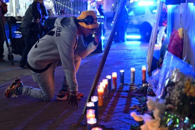 A man reacts at a memorial set up on Bourbon Street on January 2, 2025 in New Orleans, Louisiana, the day after an attack by a man driving a truck down Bourbon street in the French Quarter. A US army veteran loyal to the Islamic State jihadist group likely acted alone when he killed 14 and injured dozens in a truck attack on a crowd of New Year revelers in New Orleans, the FBI said Thursday. Despite initial concerns that Shamsud-Din Jabbar, 42, had accomplices still on the run, preliminary investigations show he likely acted alone, FBI deputy assistant director Christopher Raia said. (Photo by ANDREW CABALLERO-REYNOLDS / AFP)