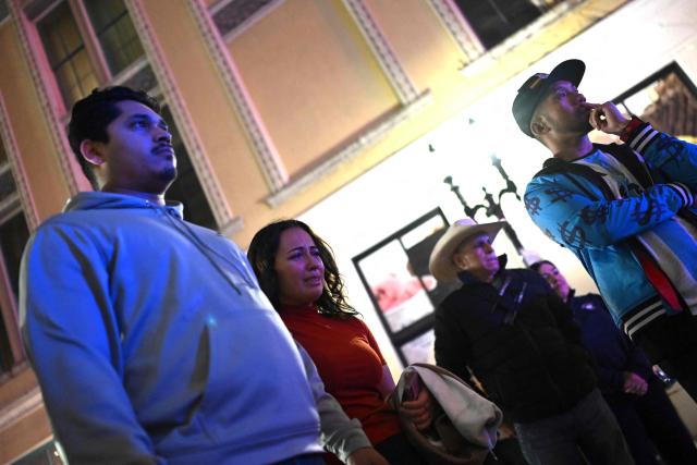 People react at a memorial set up on Bourbon Street on January 2, 2025 in New Orleans, Louisiana, the day after an attack by a man driving a truck down Bourbon street in the French Quarter. A US army veteran loyal to the Islamic State jihadist group likely acted alone when he killed 14 and injured dozens in a truck attack on a crowd of New Year revelers in New Orleans, the FBI said Thursday. Despite initial concerns that Shamsud-Din Jabbar, 42, had accomplices still on the run, preliminary investigations show he likely acted alone, FBI deputy assistant director Christopher Raia said. (Photo by ANDREW CABALLERO-REYNOLDS / AFP)