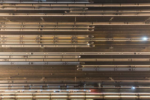 This photo taken on January 2, 2025 shows high-speed trains on stabling tracks in Nanjing, east China's Jiangsu province. China aims to expand the length of its operating high-speed rail tracks to around 60,000 km by 2030, up from 48,000 km at the end of 2024, according to the country's railway operator China State Railway Group Co., Ltd. (China Railway) on January 2nd. (Photo by AFP)