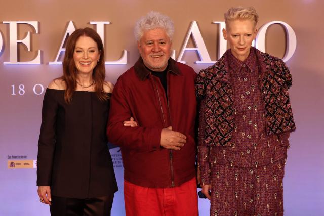 (FILES) US actrice Julianne Moore (L) and British actrice Tilda Swinton (R) pose with Spanish director Perdo Almodovar during the presentation of hid latest film "La habitacion de al lado" (The room next door) in Madrid on October 16, 2024. Can you start an American career at 75? Spanish film icon Pedro Almodуvar crosses the Atlantic for “The Room Next Door”, his first English-language feature, a twilight tale of assisted suicide starring Tilda Swinton and Julianne Moore. (Photo by Pierre-Philippe MARCOU / AFP)