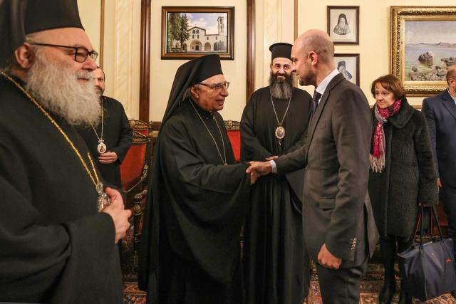 France's Foreign Minister Jean-Noel Barrot (R) is welcomed by Greek Orthodox Patriarch of Antioch and All The East John X (L), and Patriarch of the Melkite Greek Catholic Church  Youssef Absi (2-L) in Damascus on January 3, 2025. (Photo by ANWAR AMRO / AFP)