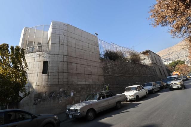 Cars are parked outside the French embassy complex in Damascus on January 3, 2025. France's Foreign Minister Jean-Noel Barrot expressed his hope during his visit on January 3 for a "sovereign, stable and peaceful" Syria as he visited Damascus for talks on behalf of the European Union. (Photo by ANWAR AMRO / AFP)