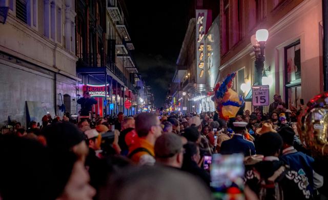 Mourners hold a vigil on Bourbon Street for the victims of the January 1 terrorist attack in New Orleans, Louisiana, on January 4, 2025. At least 15 people were killed and 30 injured on January 1 when a vehicle plowed overnight into a New Year's crowd in the heart of the thriving New Orleans tourist district, authorities in the southern US city said. (Photo by Emily KASK / AFP)