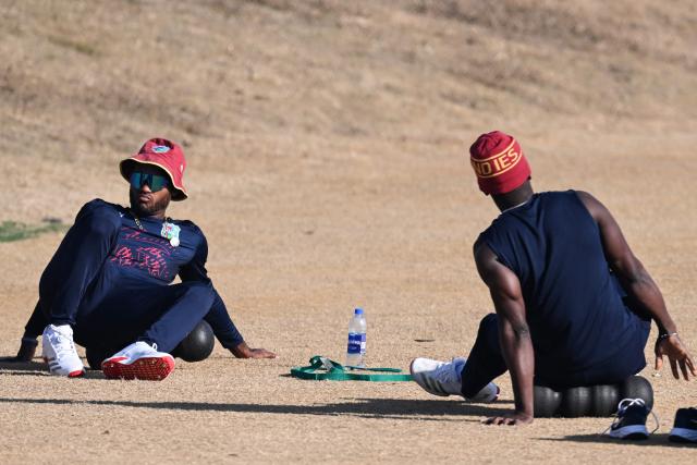 West Indies' captain Kraigg Brathwaite (L) stretches along with teammate during practice session ahead of their first Test cricket match against Pakistan, in Islamabad on January 9, 2025. (Photo by Aamir QURESHI / AFP)