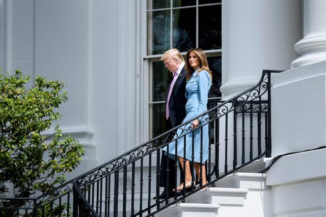 (FILES) US President Donald Trump and US first lady Melania Trump arrive during the White House Easter Egg Roll on the South Lawn of the White House on April 22, 2019 in Washington, DC. Melania Trump signaled she intends to mostly live in the White House when she returns to Washington as first lady next Monday, squelching speculation that she might split time between other residences. (Photo by Brendan Smialowski / AFP)