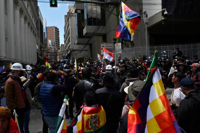 Supporters of Bolivia's former president (2006-2019), Evo Morales, gather outside the vice-presidency building during the ‘Communal for Life’ march against the government of Luis Arce and to denounce the economic crisis in La Paz on January 13, 2025. The supporters of ex-president Morales march are also calling for the release of 90 people who have been detained since last year roadblocks, and plan to arrive in La Paz on January 13. (Photo by JORGE BERNAL / AFP)