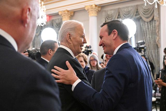 US President Joe Biden greets US Democratic Senator Chris Murphy after he finished his last Foreign Policy speech at the State Department in Washington, DC, on January 13, 2025. (Photo by ROBERTO SCHMIDT / AFP)