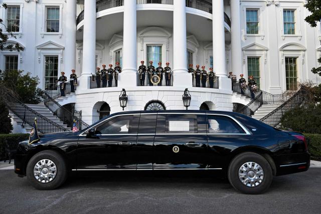 The US President’s limousine can be seen near an honor guard after he returned to the White House after speaking at the State Department in Washington, DC, on January 13, 2025. (Photo by ROBERTO SCHMIDT / AFP)