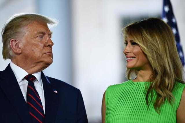 (FILES) US First Lady Melania Trump smiles to US President Donald Trump atthe conclusion of the final day of the Republican National Convention from the South Lawn of the White House on August 27, 2020 in Washington, DC. Melania Trump signaled she intends to mostly live in the White House when she returns to Washington as first lady next Monday, squelching speculation that she might split time between other residences. (Photo by Brendan Smialowski / AFP)