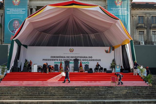 Workers do final preparations at the stage at Independence Square where Mozambique President-elect Daniel Chapo will be sworn into office in Maputo on January 15, 2025. (Photo by PHILL MAGAKOE / AFP)