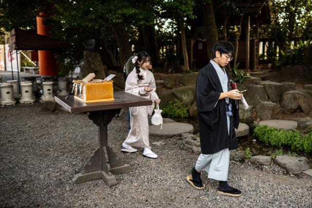 People visit the Hikawa Shrine in Kawagoe city, known locally as "The Little Edo" and famous for its historic buildings, in Saitama Prefecture on January 15, 2025. Japan is expected to announce tourist figures for the year 2024 later in the day on January 15, widely expected to break the record set in 2019. (Photo by Philip FONG / AFP)