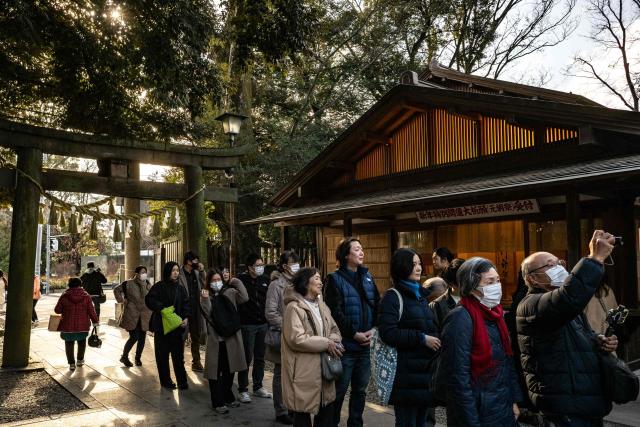 People visit the Hikawa Shrine in Kawagoe city, known locally as "The Little Edo" and famous for its historic buildings, in Saitama Prefecture on January 15, 2025. Japan is expected to announce tourist figures for the year 2024 later in the day on January 15, widely expected to break the record set in 2019. (Photo by Philip FONG / AFP)