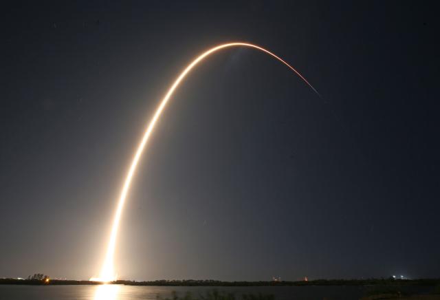 A SpaceX Falcon 9 rocket, carrying Firefly Aerospace's Blue Ghost and ispace's Resilience lunar landers,  streaks into orbit after lifting off from Launch Complex 39A at the Kennedy Space Center in Cape Canaveral, Florida, on January 15, 2025. USA's Firefly and Japan's ispace aim to build on the success of Texas-based Intuitive Machines, which last year became the first company to successfully touch down on Earth's celestial neighbor. (Photo by Gregg Newton / Gregg Newton / AFP)