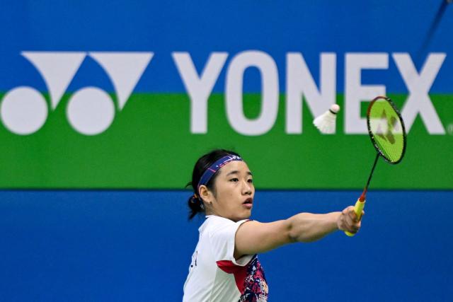 South Korea’s An Se-Young plays against Taiwan's Chiu Pin-Chian during their women’s singles match at the Yonex-Sunrise India Open 2025 badminton tournament in New Delhi on January 15, 2025. (Photo by Money SHARMA / AFP)