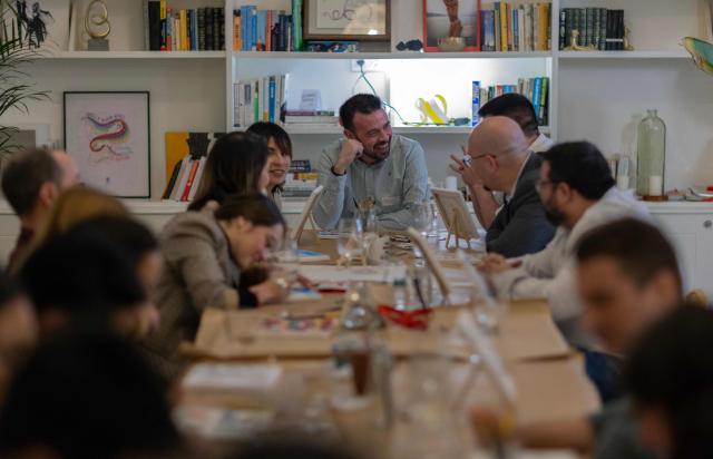 A group of people take part in a singles meeting organised by the "Slow dating club" in Madrid on December 29, 2024. Jilted by dating apps but undeterred in the quest for romance, 20 young singles gathered in Madrid to share activities and flirtatious smiles in a rediscovery of real-life love. The 10 men and 10 women, aged between 25 and 35, had eyed each other up nervously barely an hour before their first plunge into the "slow dating club". The concept is gaining popularity in Europe as youngsters fall out of love with apps and try to find their potential soul mate through serendipitous face-to-face encounters. (Photo by Pierre-Philippe MARCOU / AFP)