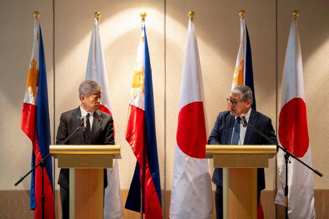 Philippine Foreign Minister Enrique Manalo (R) and Japan's Foreign Minister Takeshi Iwaya (L) hold a joint press conference in Manila on January 15, 2025. (Photo by LISA MARIE DAVID / POOL / AFP)