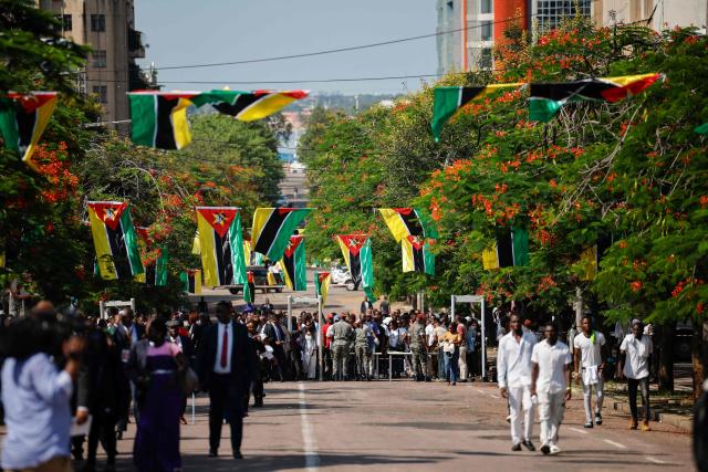 Mozambique soldiers screen guests at a checkpoint ahead of Mozambique President-elect Daniel Chapo's inauguration at Independence Square in Maputo on January 15, 2025. (Photo by PHILL MAGAKOE / AFP)