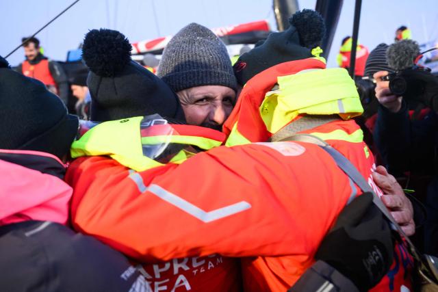 French skipper Yoann Richomme, on his Imoca 60 monohull Paprec Arkea, celebrates with his team as he arrives at the port, finishing in second place in the 10th edition of the Vendee Globe around the world monohull solo sailing race in Les Sables-d'Olonne, western France, on January 15, 2025. (Photo by Loic VENANCE / AFP)