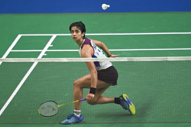 India’s Malvika Bansod plays against China’s Han Yue during their women’s singles match at the Yonex-Sunrise India Open 2025 badminton tournament in New Delhi on January 15, 2025. (Photo by Money SHARMA / AFP)