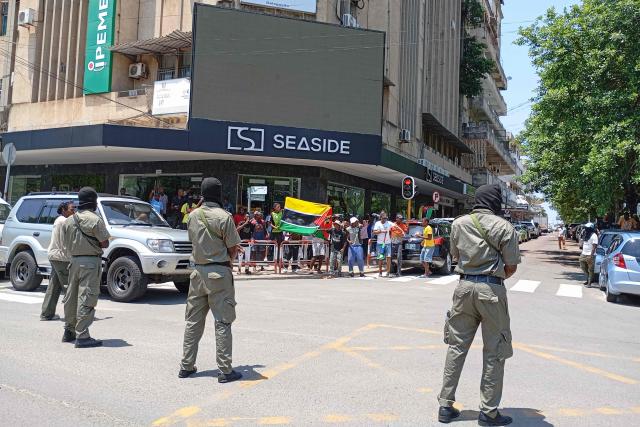 Mozambique police officers look on as people gather to protest in Maputo on January 15, 2025. as Daniel Chapo takes oath of office to be sworn in as the President of Mozambique during his inauguration at Independence Square. Mozambique swore in Daniel Chapo as president on January 15, 2025 following months of post-election violence that an NGO says has killed more than 300 people.
Vowing "to devote all my energies to defending, promoting and consolidating national unity", Chapo, 48, extends his Frelimo party's 50-year rule of the gas-rich African nation. Opposition candidate Venancio Mondlane claims that the October 2024 election was rigged. (Photo by PHILL MAGAKOE / AFP)