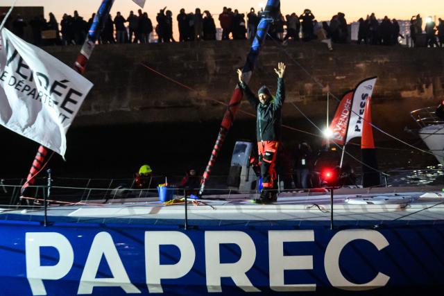 French skipper Yoann Richomme, on his Imoca 60 monohull Paprec Arkea, celebrates as he enters the channel to finish in second place in the 10th edition of the Vendee Globe around the world monohull solo sailing race in Les Sables-d'Olonne, western France, on January 15, 2025. (Photo by Loic VENANCE / AFP)