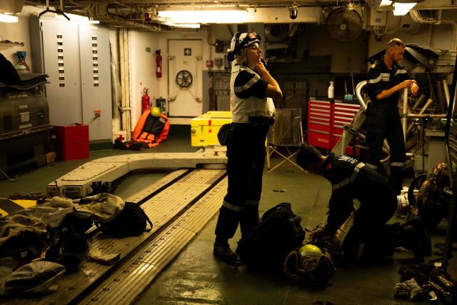 Medical staff members prepare for a medical evacuation mission by Eurocopter AS565 Panther military helicopter military helicopter aboard the French surveillance frigate FS Ventose sailing on a mission off the French Caribbean island of Martinique, on November 14, 2024. The French surveillance frigate FS Ventose is deployed at sea on a Narcops mission to intercept narco-traffickers' vessels potentially transporting narcotics, as part of the fight against drug trafficking in the French West Indies. (Photo by JULIEN DE ROSA / AFP)