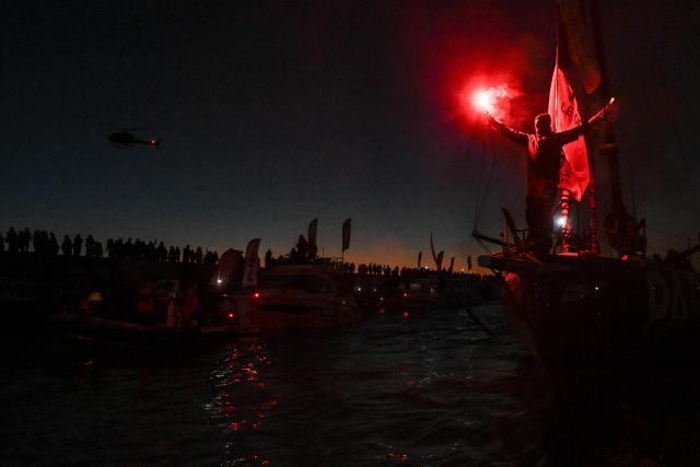 French skipper Yoann Richomme, on his Imoca 60 monohull Paprec Arkea, enters the channel to finish in second place in the 10th edition of the Vendee Globe around the world monohull solo sailing race in Les Sables-d'Olonne, western France, on January 15, 2025. (Photo by Sebastien Salom-Gomis / AFP)