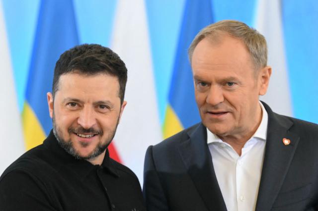 Ukraine's President Volodymyr Zelensky (L) meets with Polish Prime Minister Donald Tusk as he visits Warsaw, Poland on January 15, 2025. (Photo by Sergei GAPON / AFP)