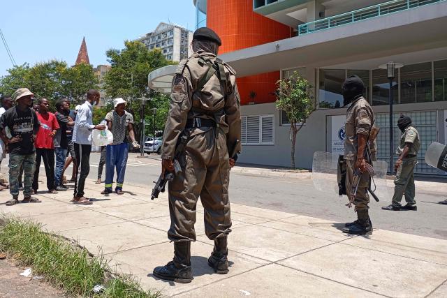 Mozambique police officers look on as people gather to protest in Maputo on January 15, 2025, as Daniel Chapo takes oath of office to be sworn in as the President of Mozambique during his inauguration at Independence Square. Mozambique swore in Daniel Chapo as president on January 15, 2025 following months of post-election violence that an NGO says has killed more than 300 people.
Vowing "to devote all my energies to defending, promoting and consolidating national unity", Chapo, 48, extends his Frelimo party's 50-year rule of the gas-rich African nation. Opposition candidate Venancio Mondlane claims that the October 2024 election was rigged. (Photo by Amilton Neves / AFP)