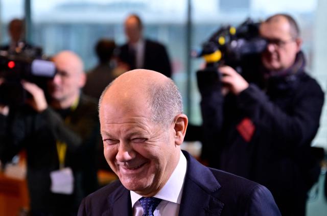 German Chancellor Olaf Scholz has a laugh as he arrives for the weekly cabinet meeting at the Chancellery in Berlin on January 15, 2025. (Photo by John MACDOUGALL / AFP)